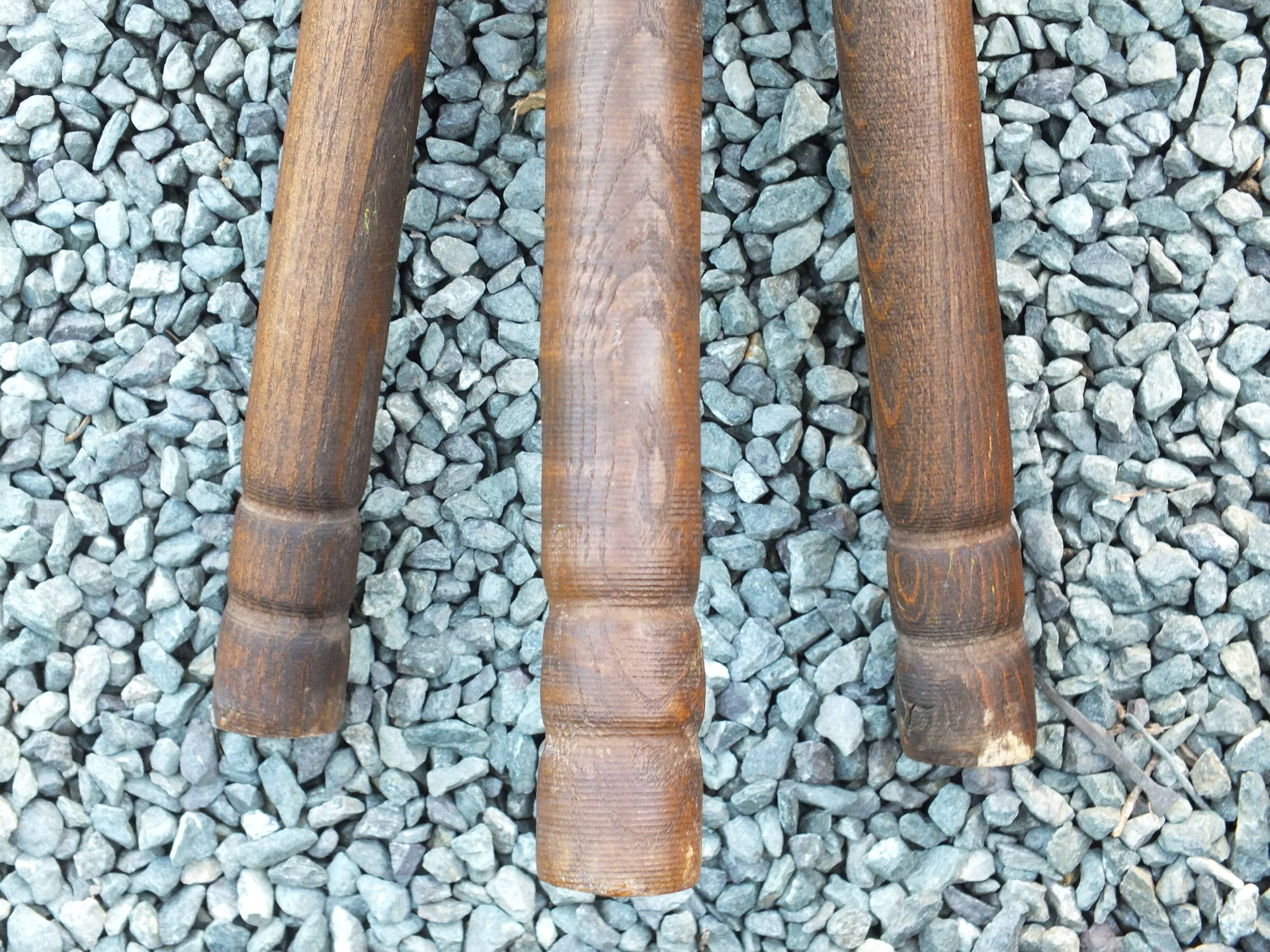 Pair of triangular turned wood stools or harnesses