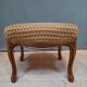 Pouf upholstered legs cambered in mahogany