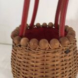Wicker basket with a wooden bead border