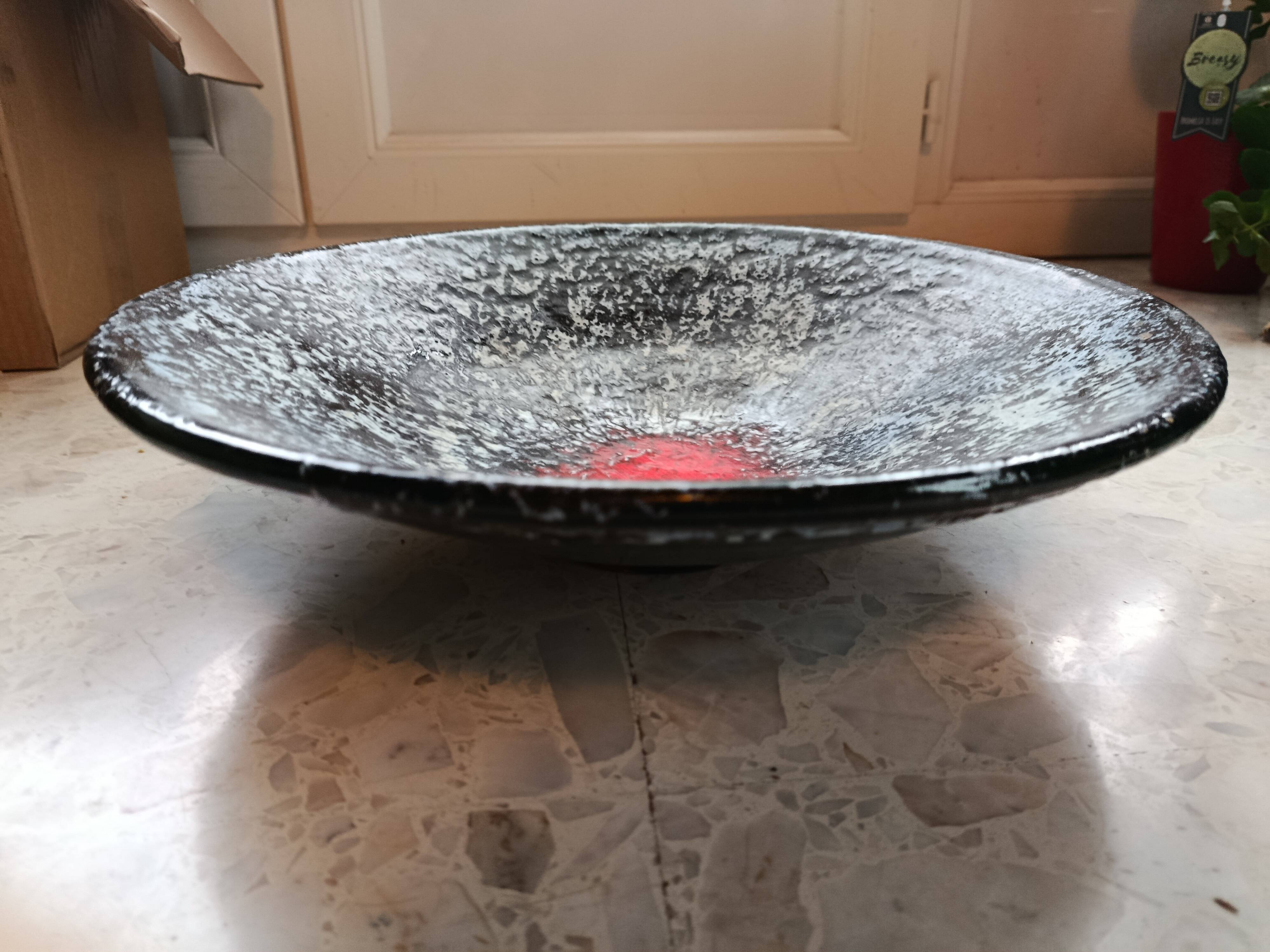 Large stoneware platter signed c. pitot, mid-20th century, black, white, and red glazed ceramic