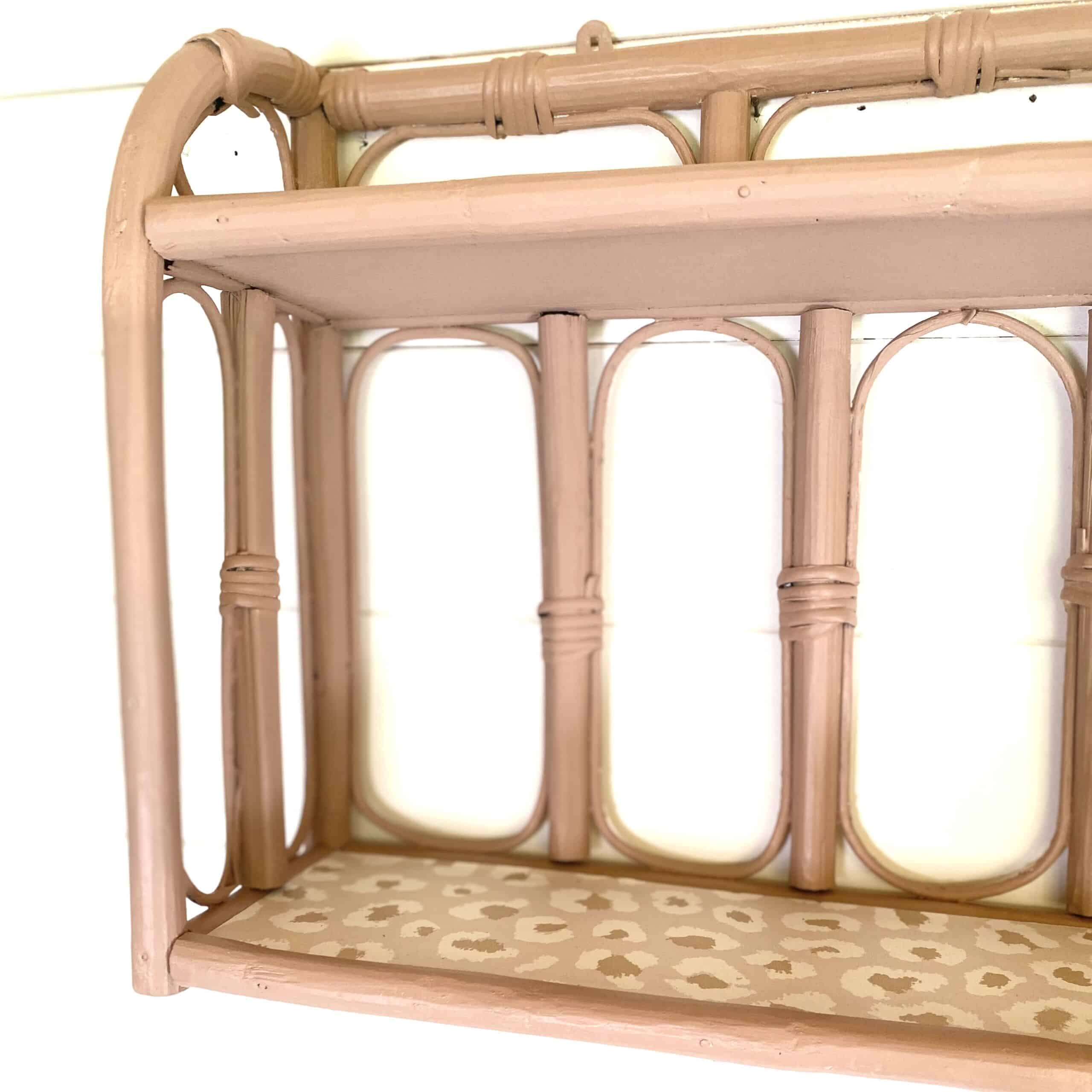 Pale pink rattan wall shelf