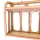 Pale pink rattan wall shelf