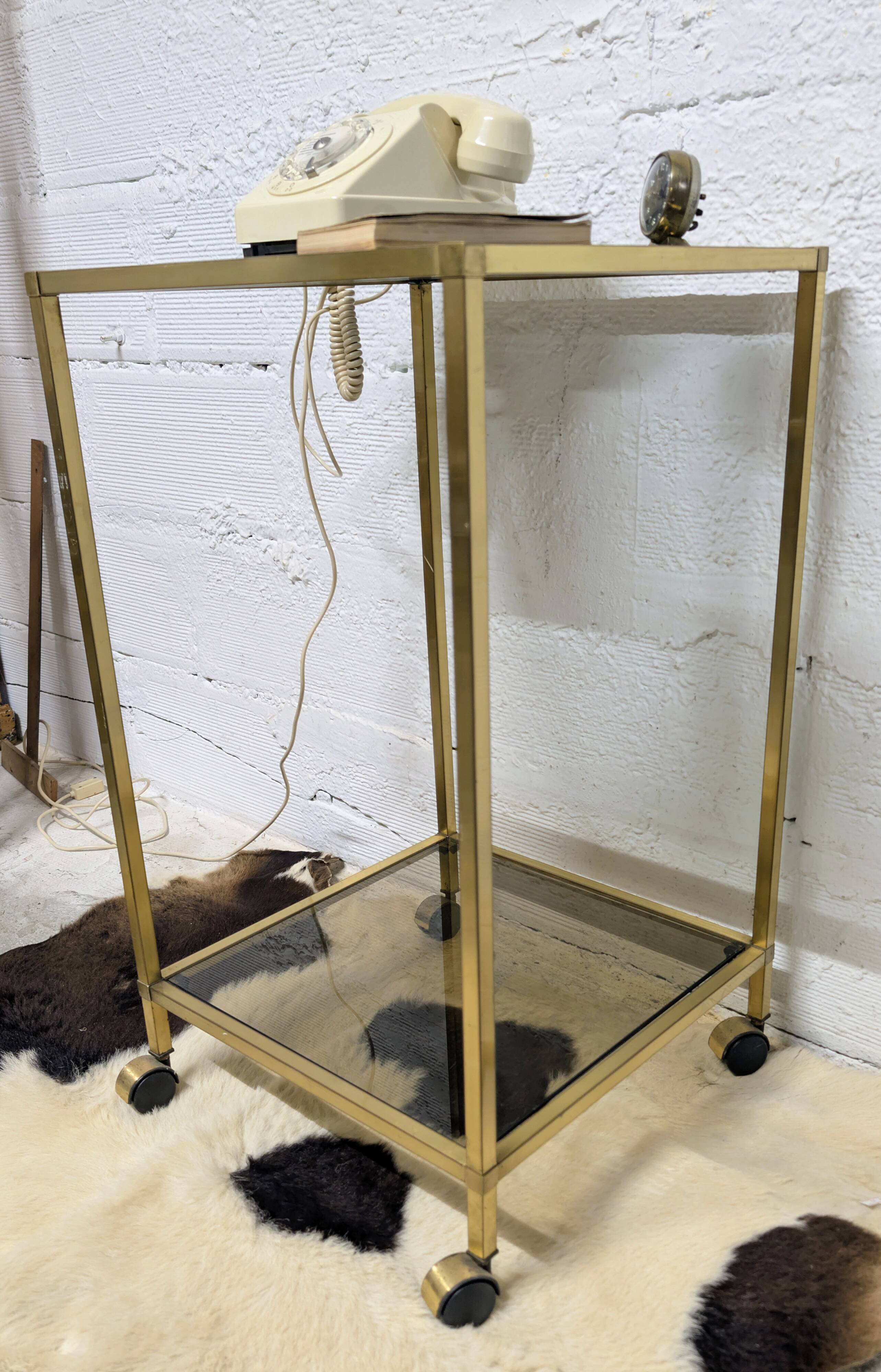 Vintage rolling table in brass and smoked glass