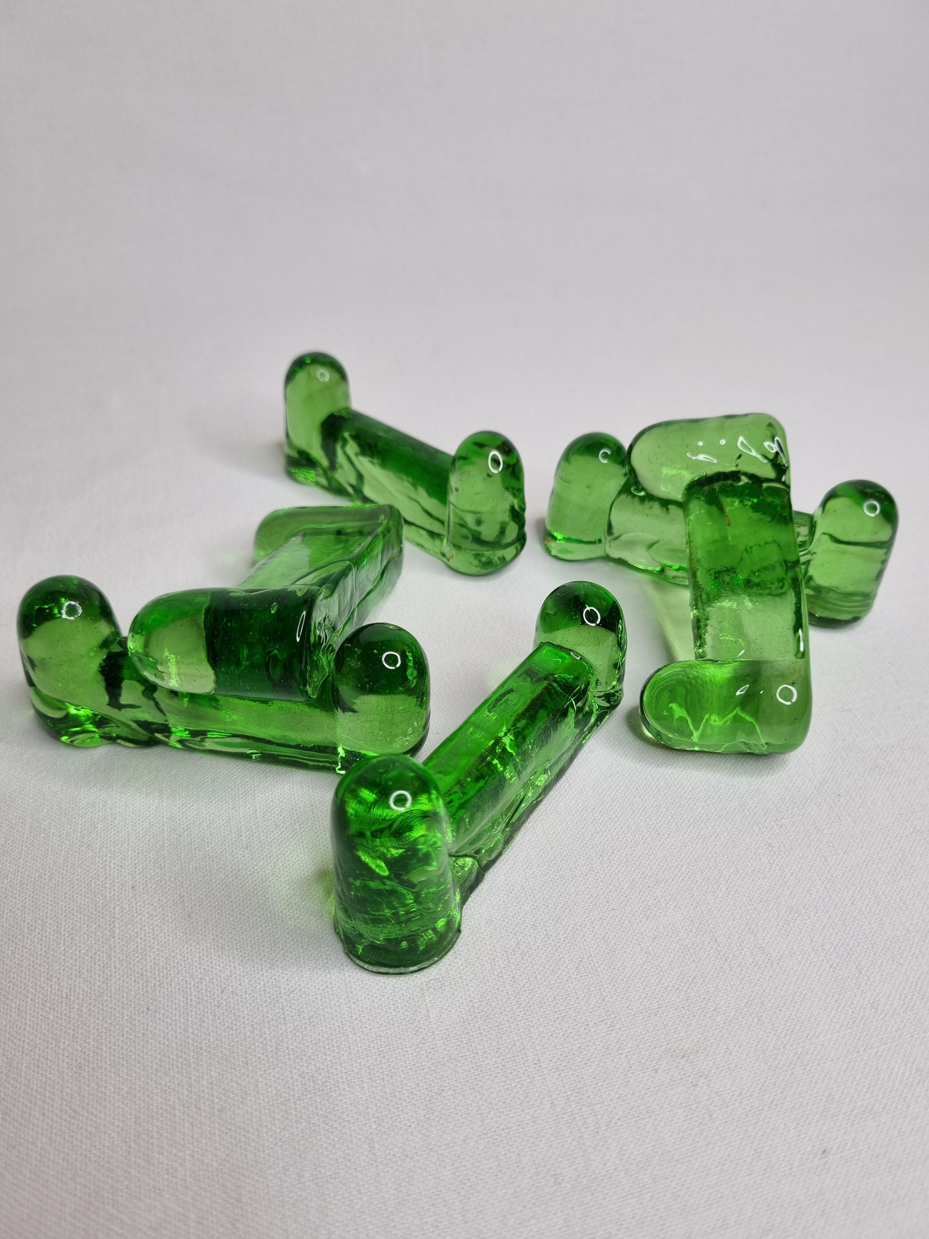 Set of six emerald glass knife holders signed Biot