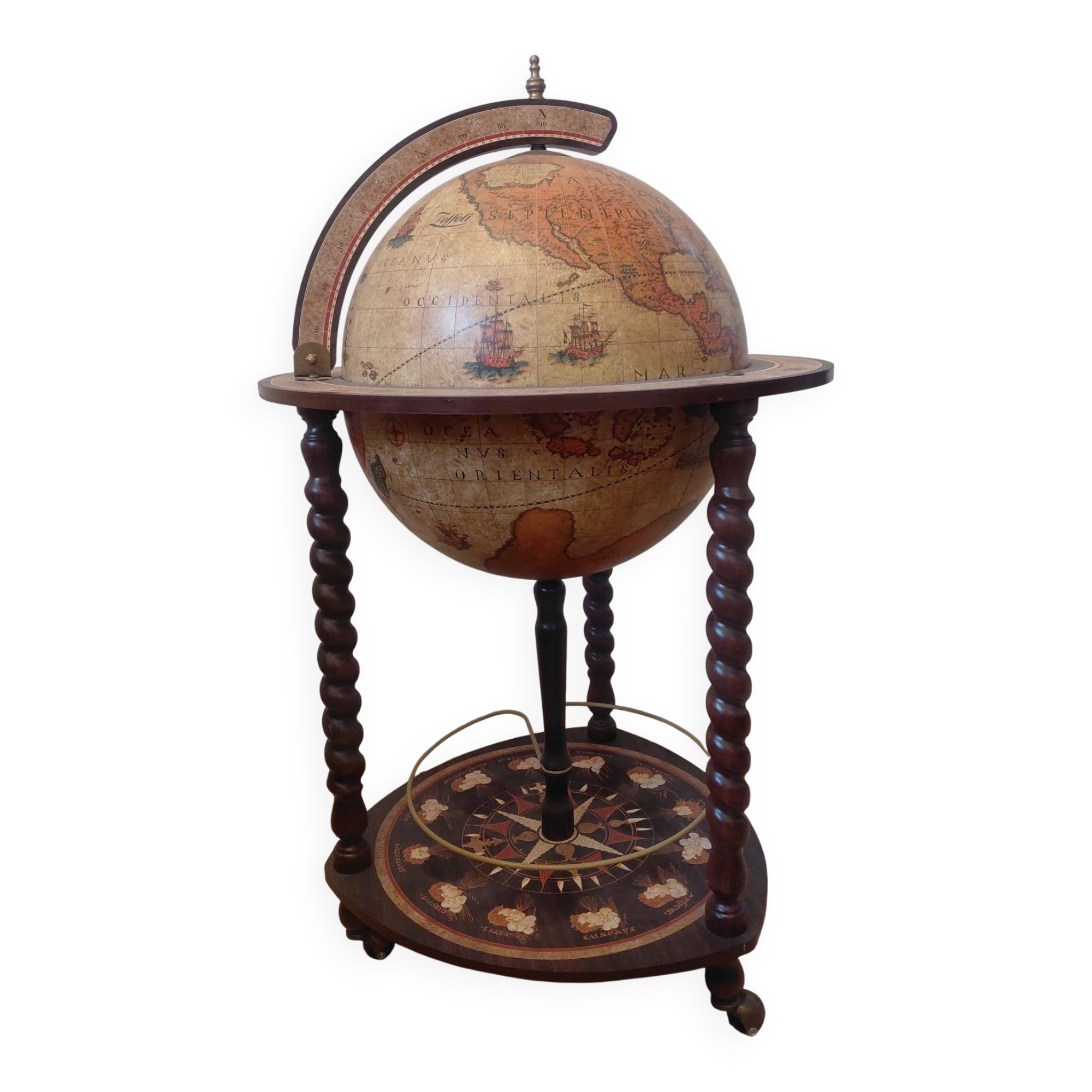 Vintage globe bar with storage for bottles and glasses.
