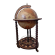 Vintage globe bar with storage for bottles and glasses.