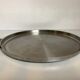 Large flat metal and wood platter in Scandinavian style.
