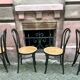 Two pairs of black 50s chairs - number 18 - cannée