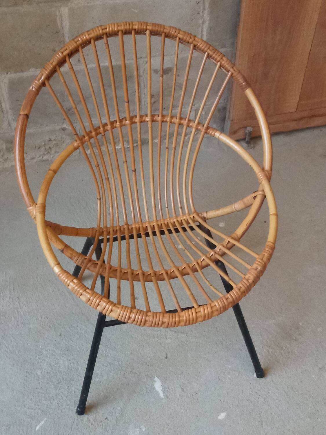 Rattan armchair with metal base from the 1950s