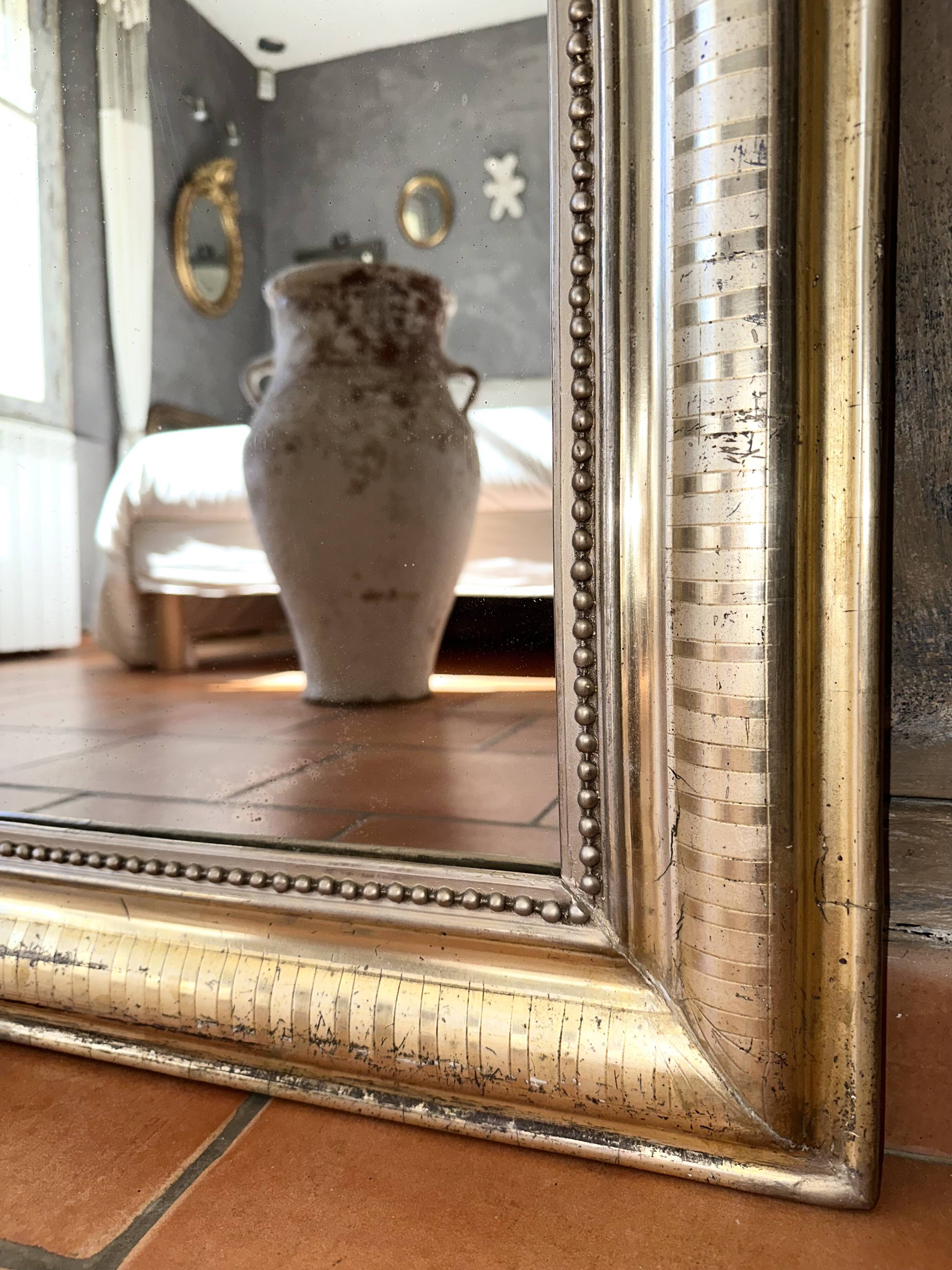 Louis-Philippe antique mirror with silver leaf, 19th century.