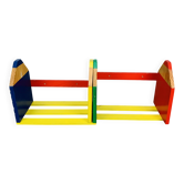 Modular wall-mounted pencil shelf in Pierre Sala style, for children.
