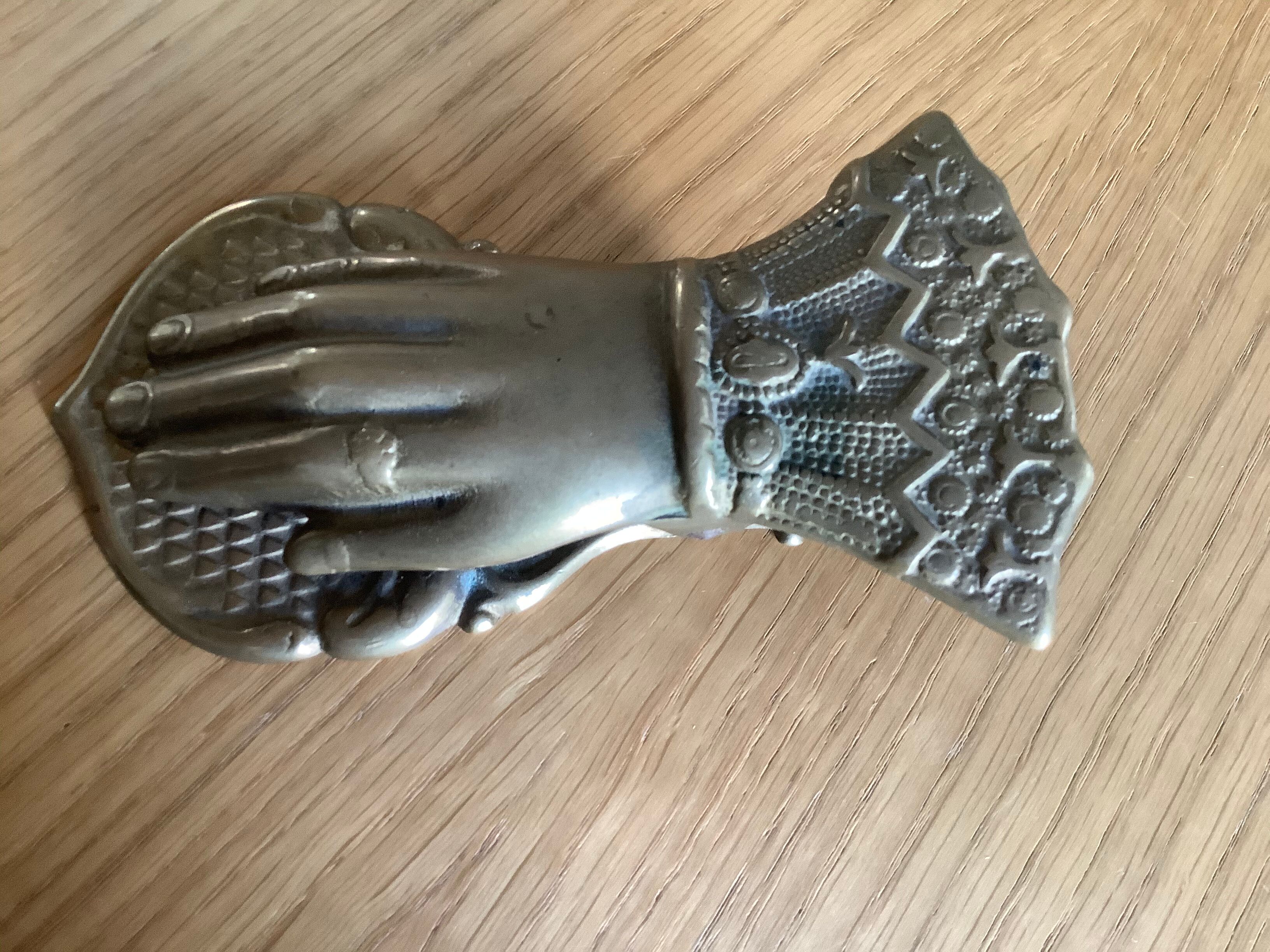 Brass paper press hand shape