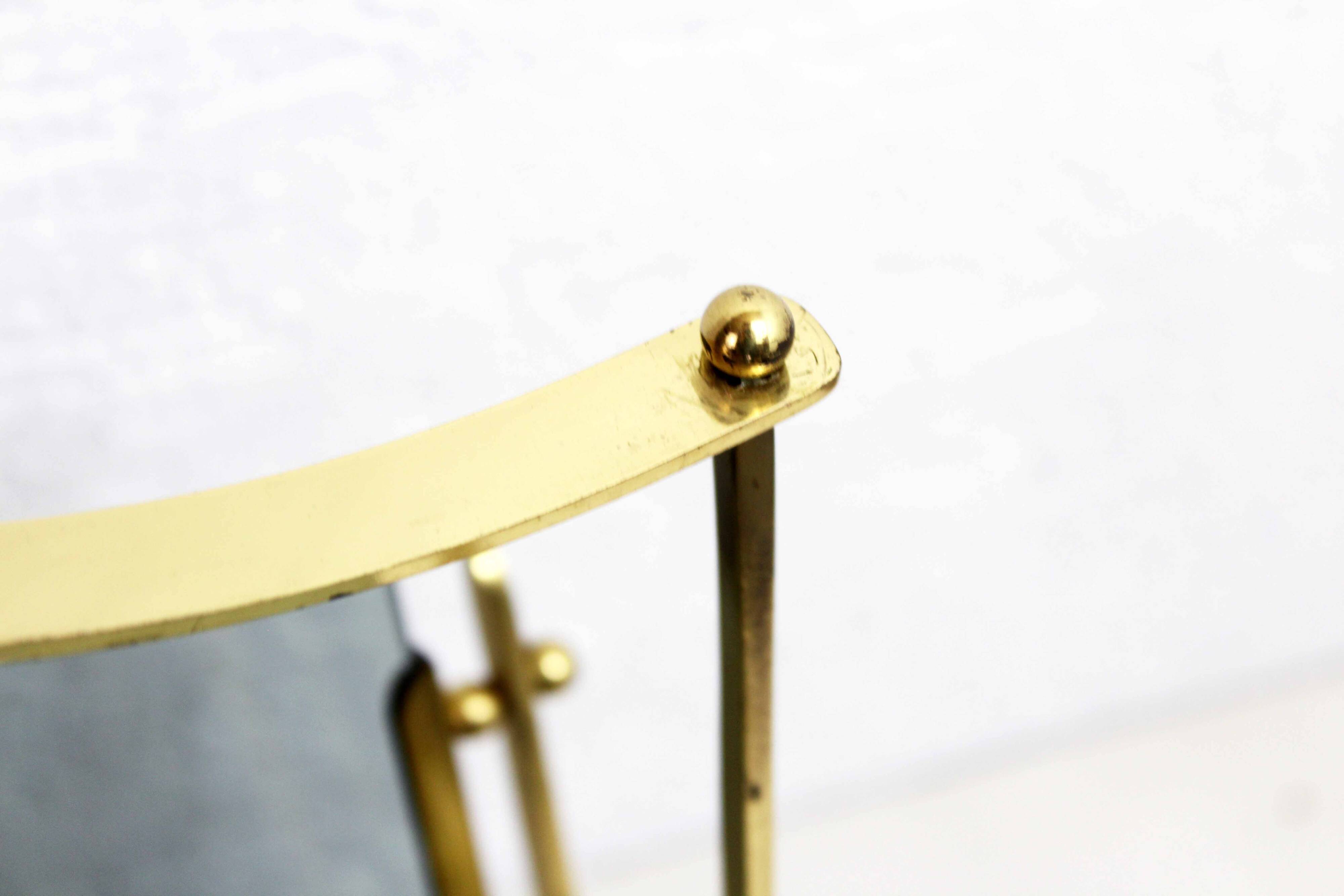 Glass and brass magazine rack, 1970