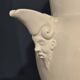 Large white faience jug with a satyr head spout, 19th century.