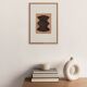 Abstract painting on framed paper signed Eawy in brown and black.