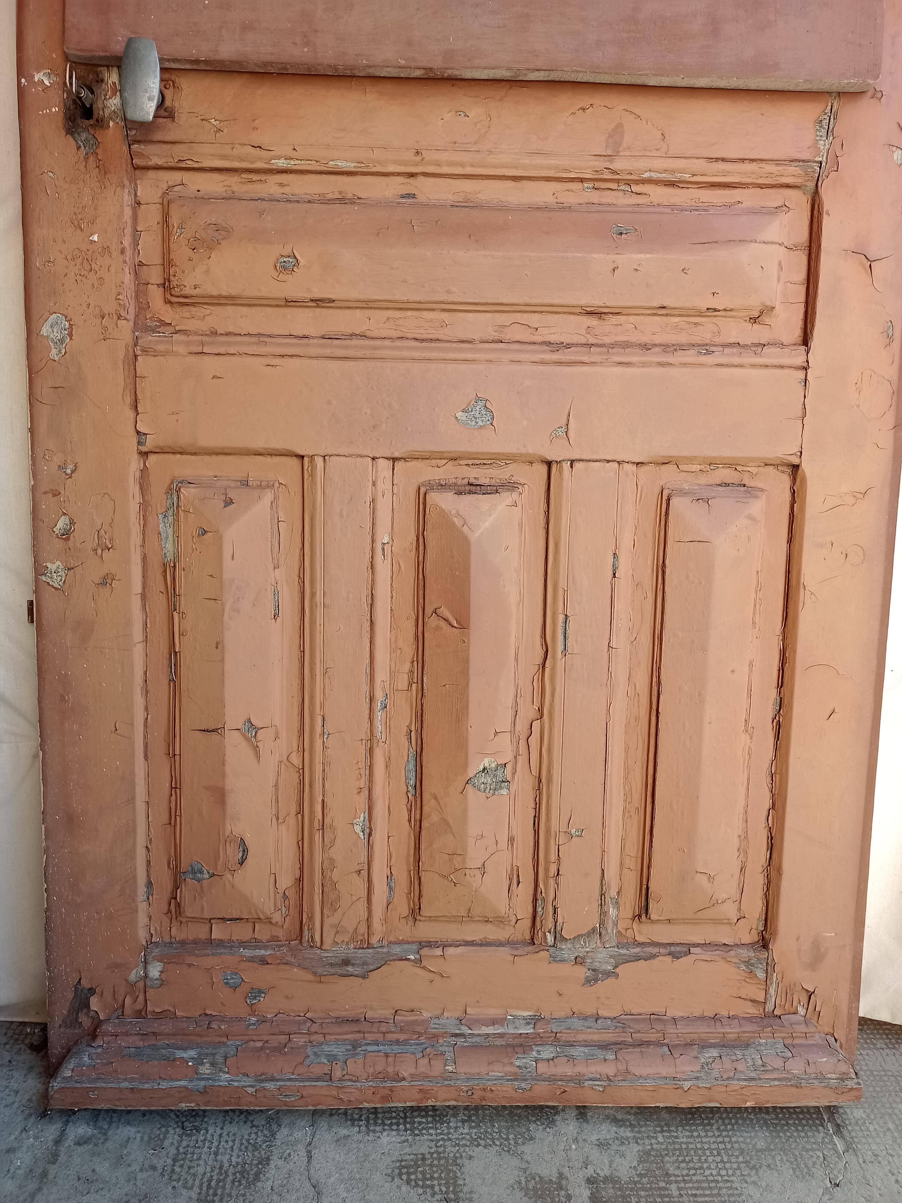 Old glazed door with its shutter