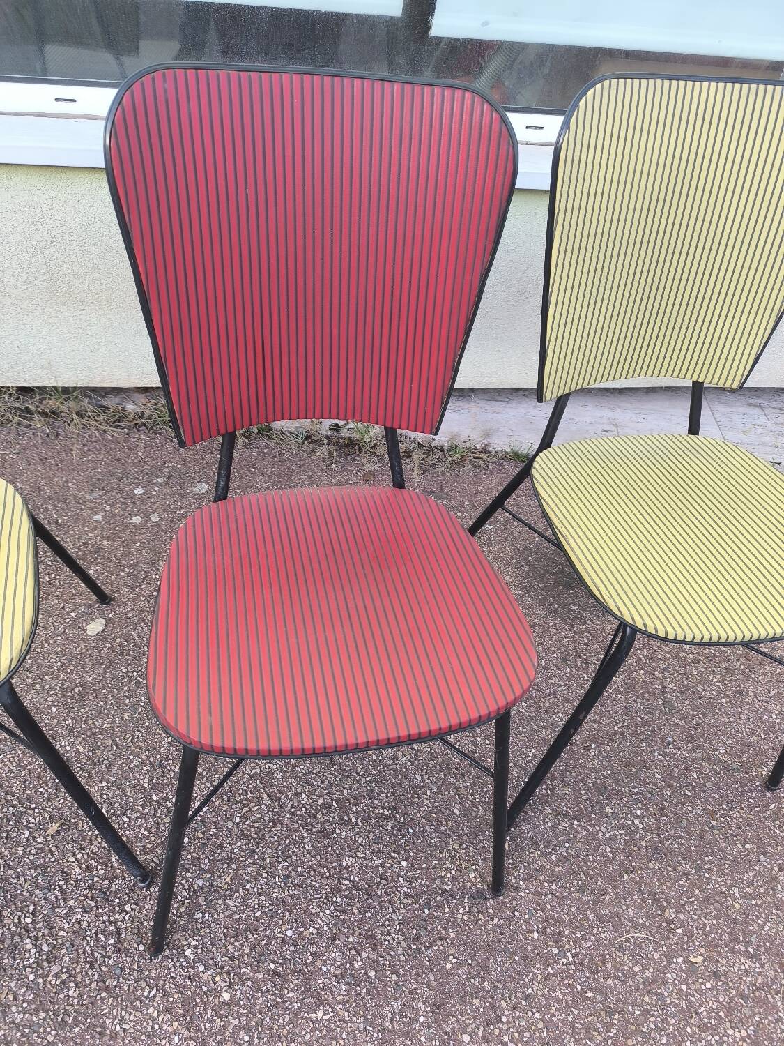 Set of 3 vintage yellow and red faux leather chairs.