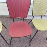 Set of 3 vintage yellow and red faux leather chairs.