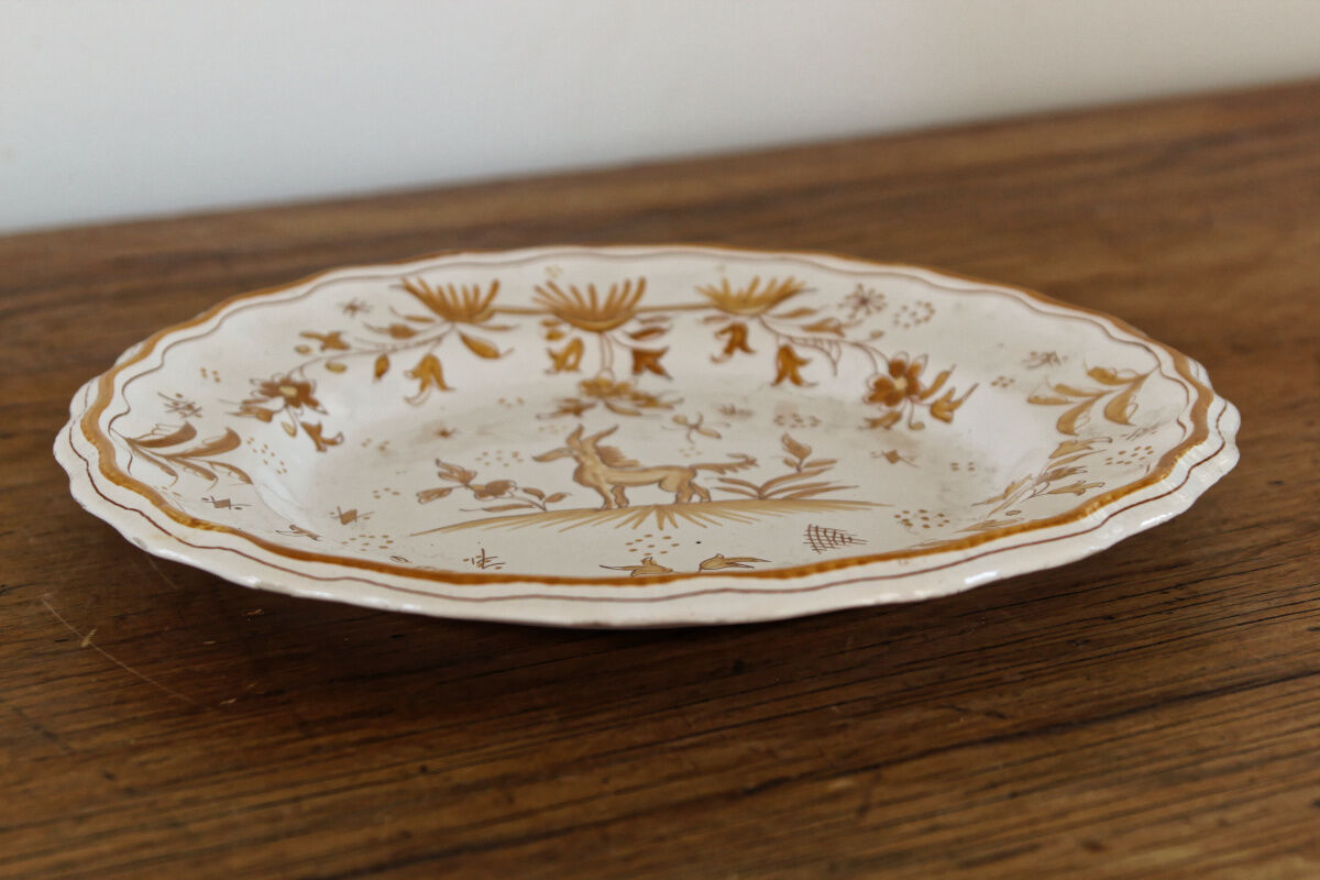 Signed Moustiers plate, in yellow shades