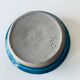 Blue enamelled sandstone candlestick