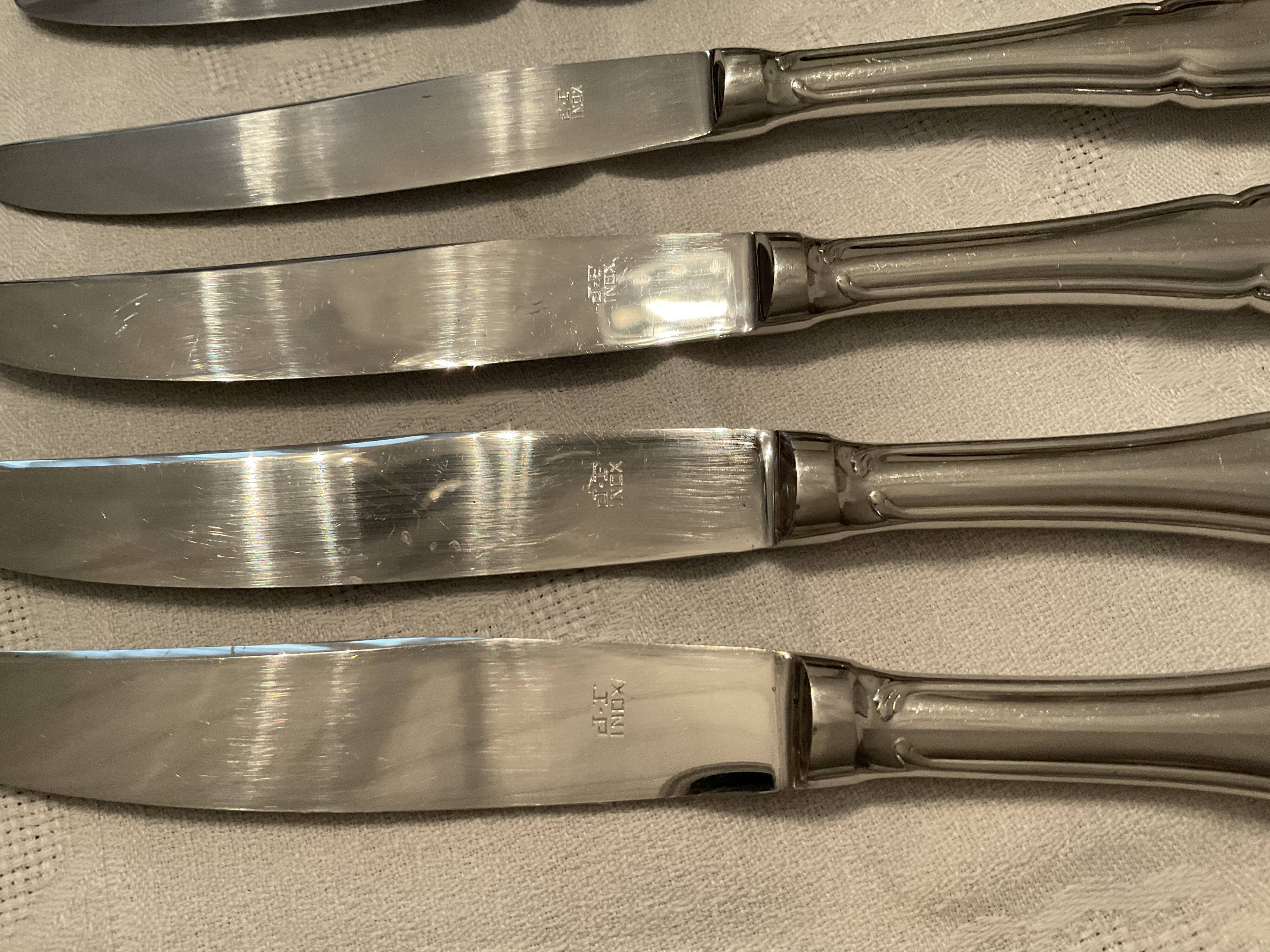 12 stainless steel knives. vintage