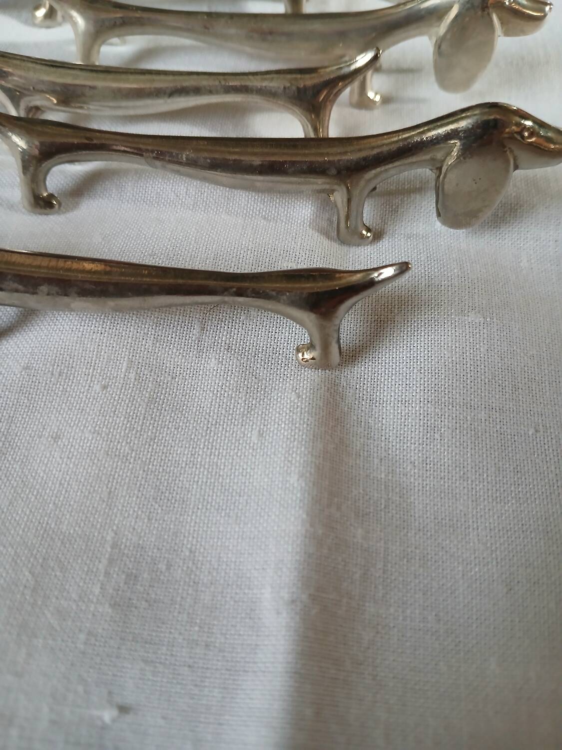 8 metal knife holders/dogs