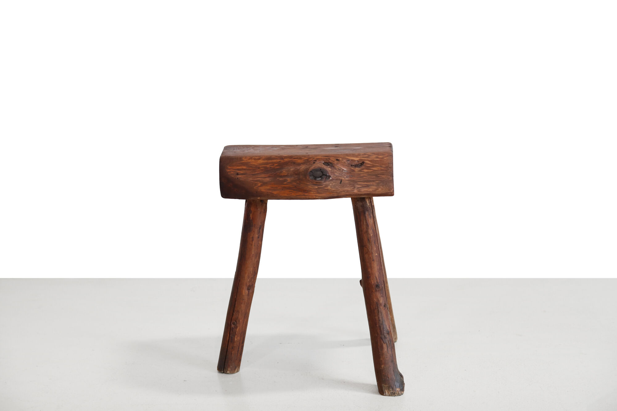 French brutalist tree trunk stools