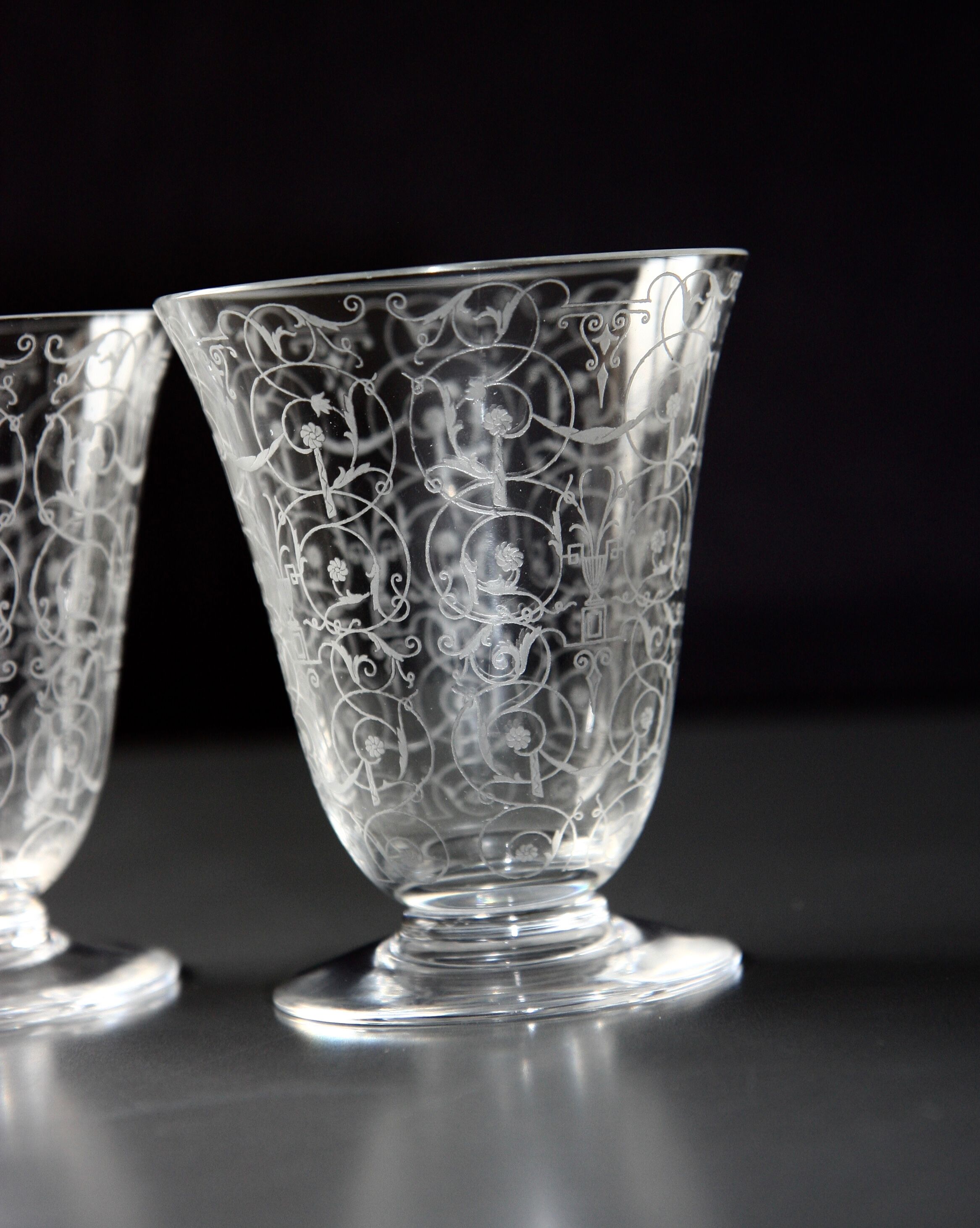 Two Baccarat glasses model "Michelangelo" in engraved crystal.