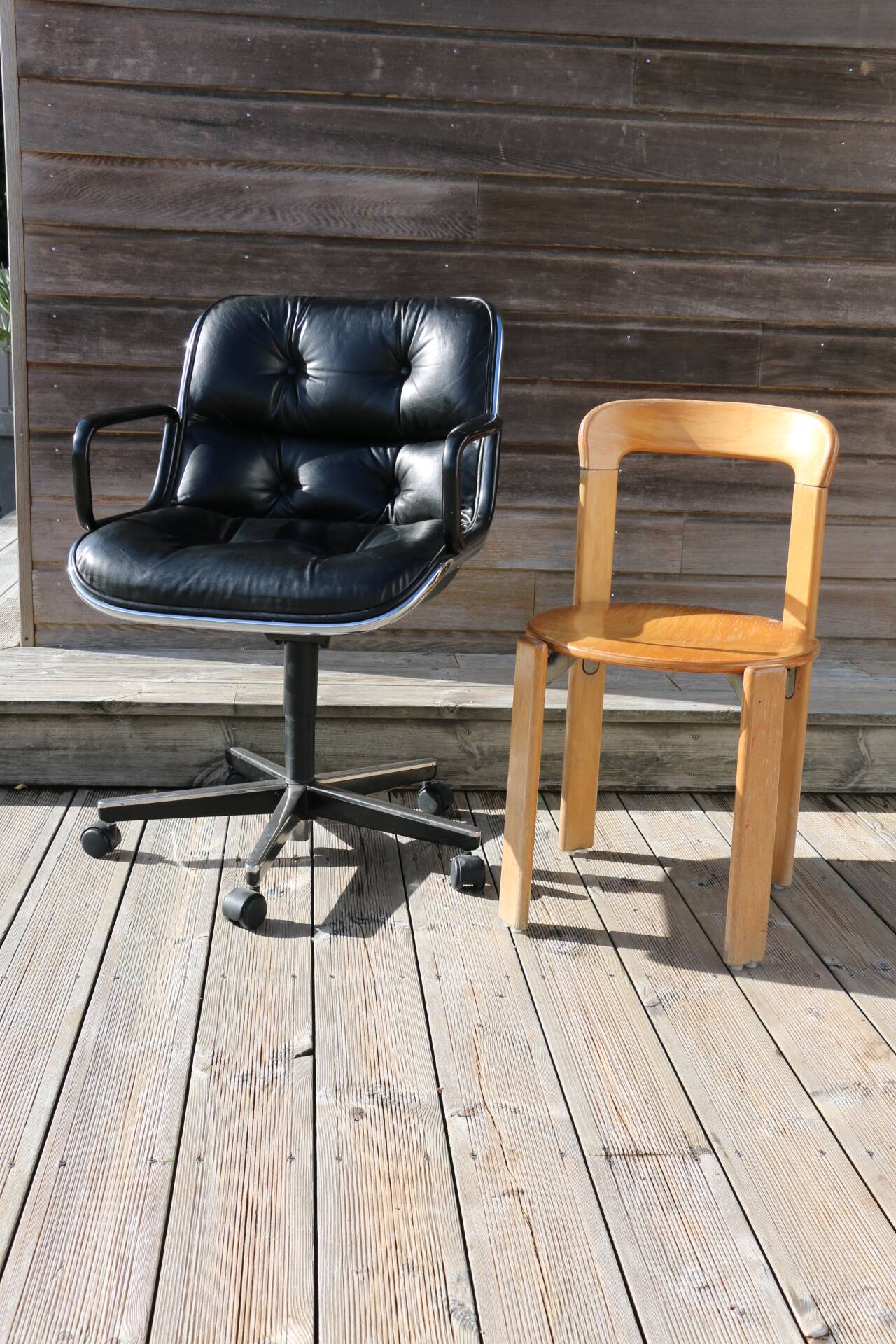 POLLOCK black leather reclining armchair with casters