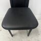 Set of eight designer chairs in black leather from the 20th century
