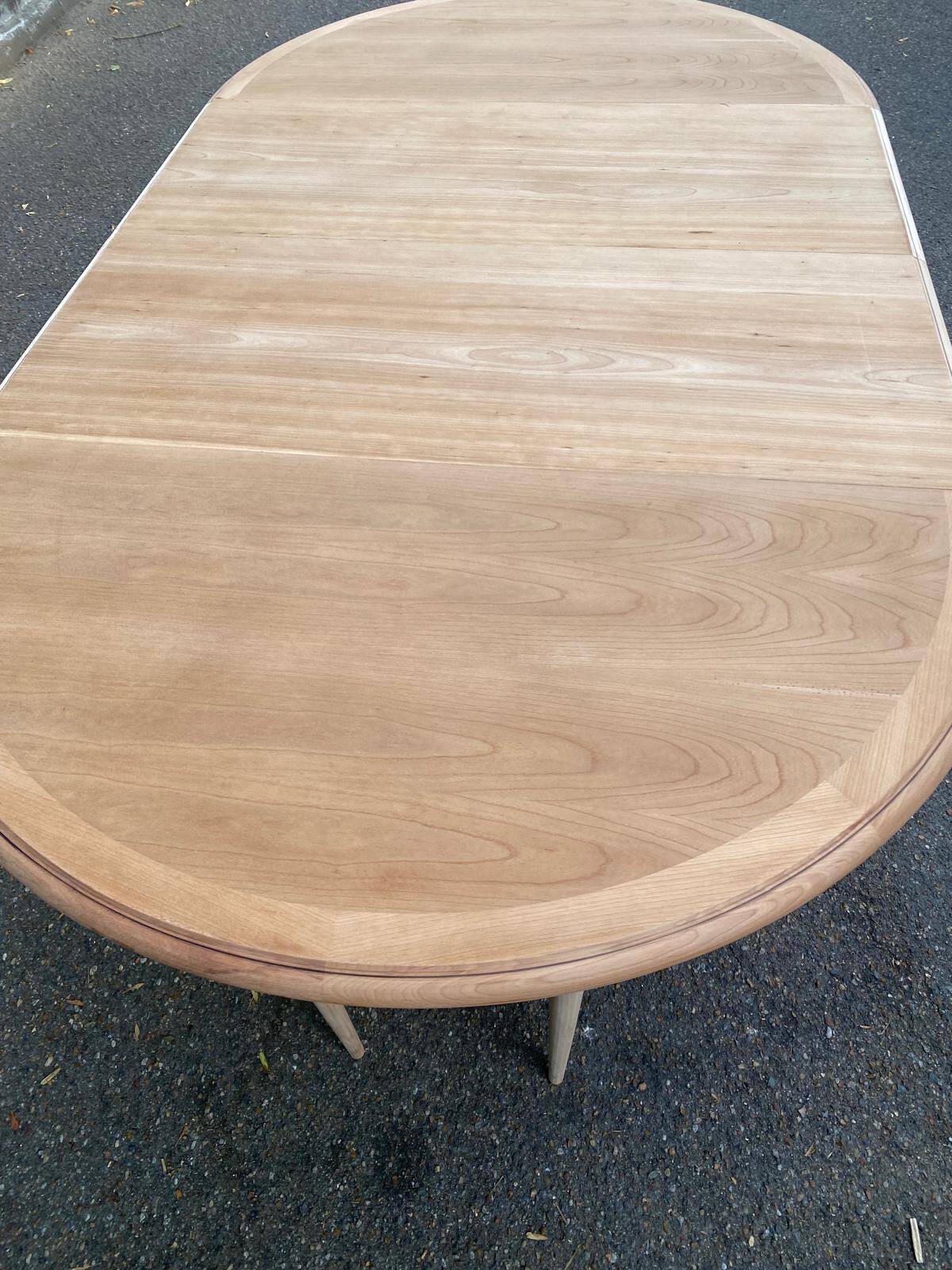 Large extendable round dining table stripped with a central wooden leg 110-198cm.