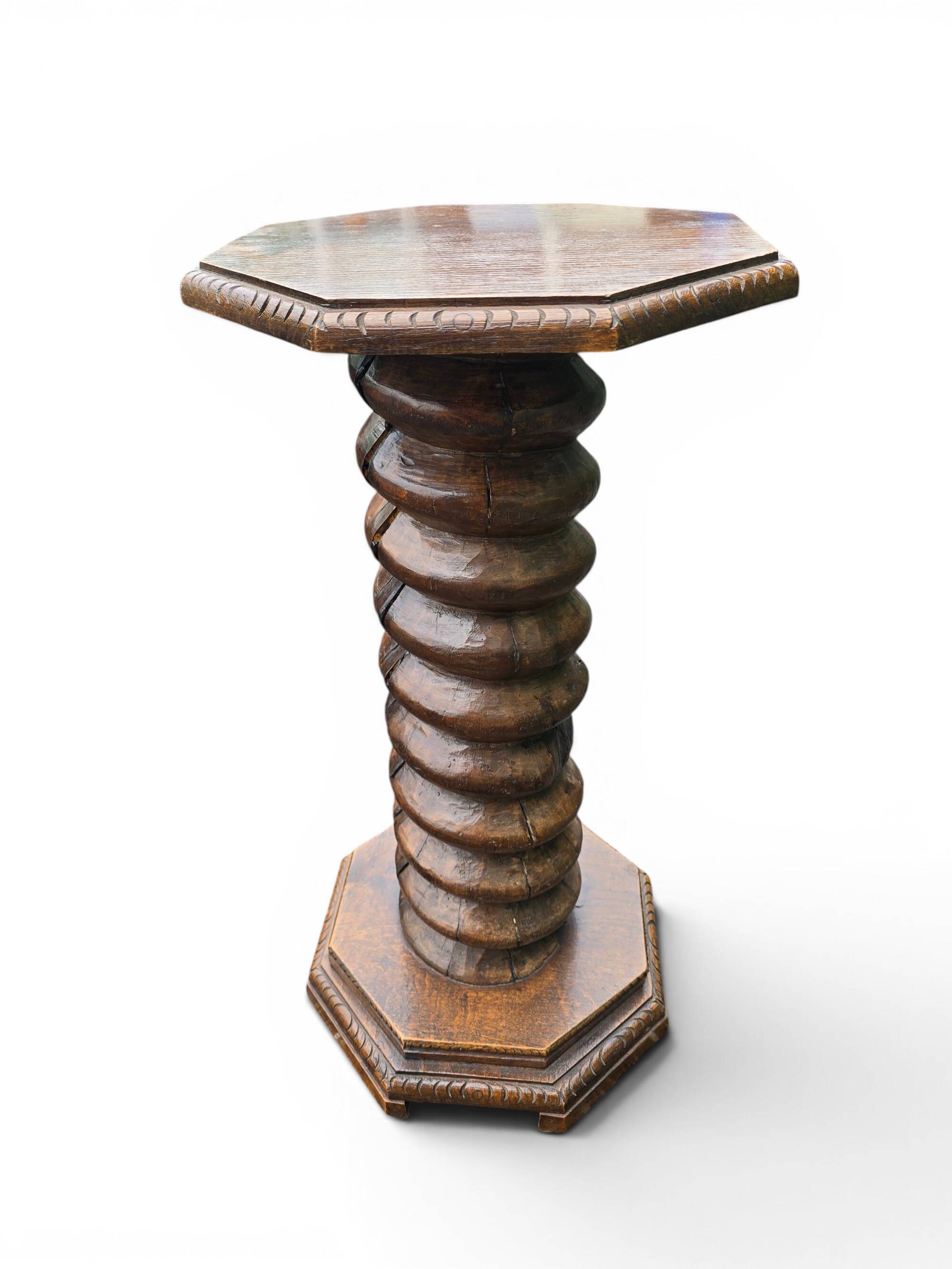 Antique carved solid oak pedestal, octagonal top and turned column.