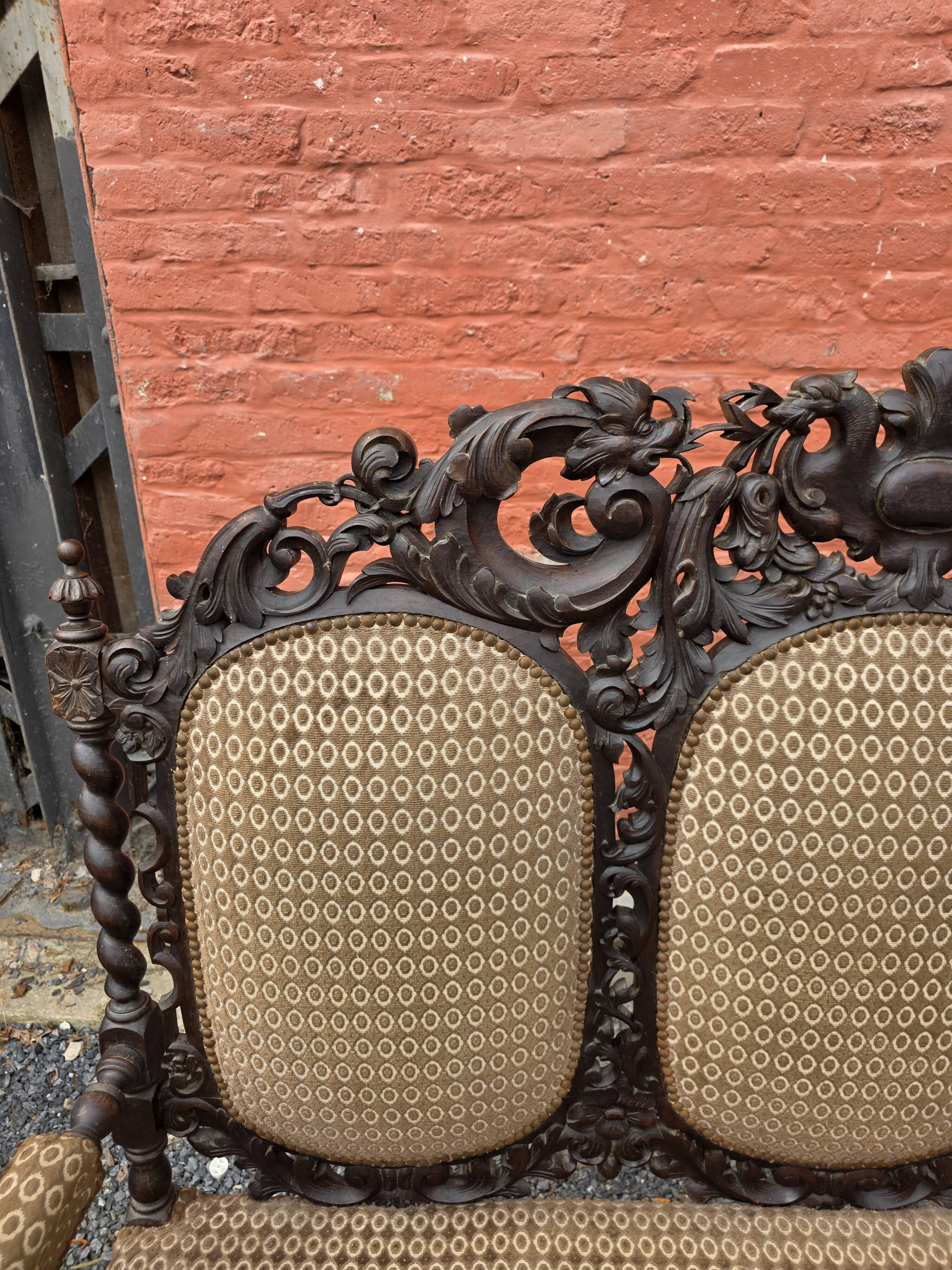 Three-seater armchair in Louis XIII style made of oak from the 19th century.