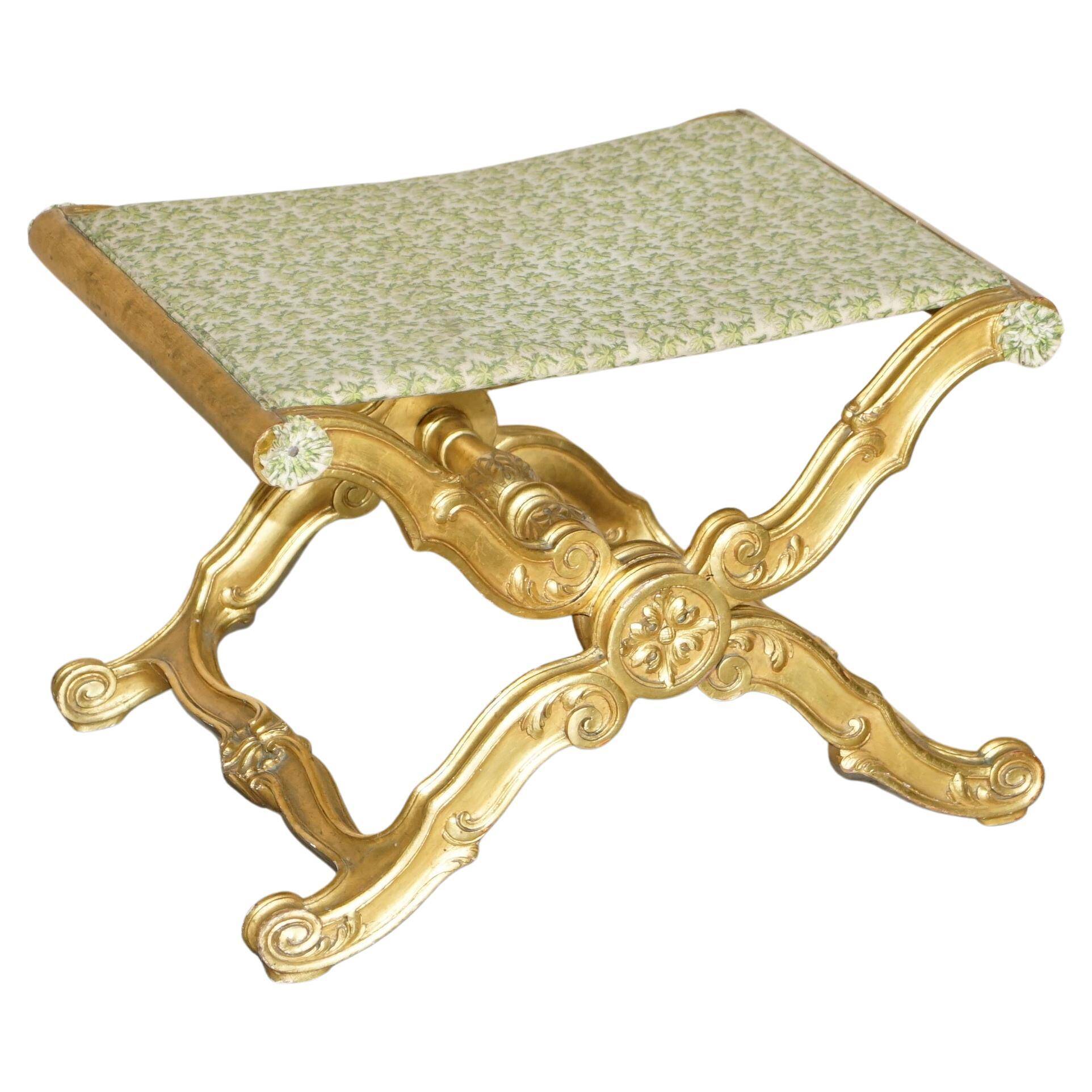 Folding stool with X-frame, carved golden wood, 19th century.