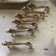 12 vintage gilded gold metal lion animal knife holders