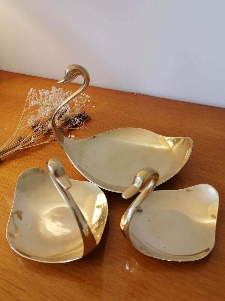 Empty brass swan pocket