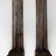 Pair of ancient cast iron chenets adorned with bust of Marianne