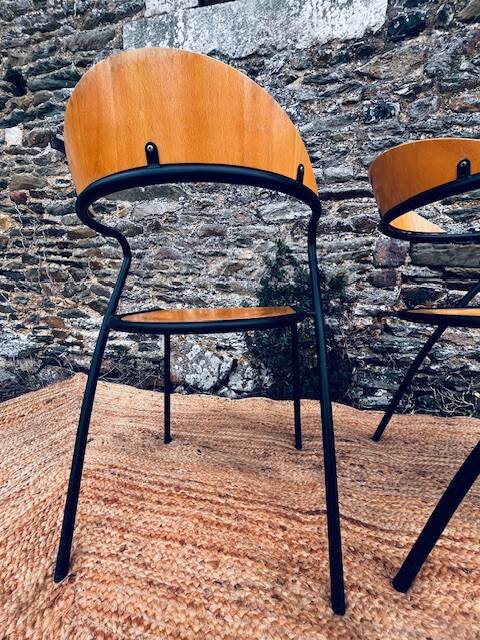 Pair of wooden and black metal chairs