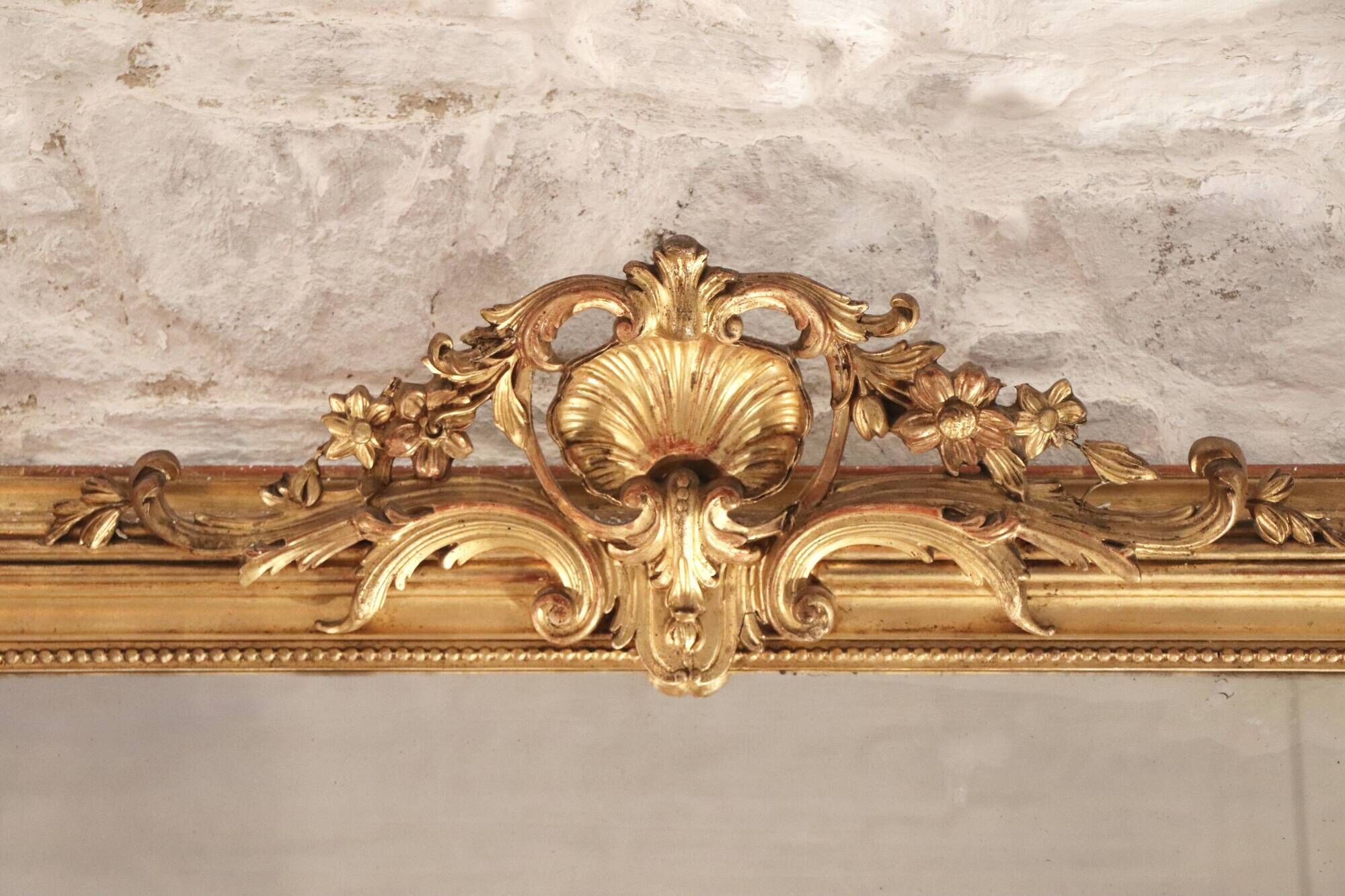 Manor house trumeau mirror in gilded wood, 19th century