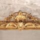 Manor house trumeau mirror in gilded wood, 19th century