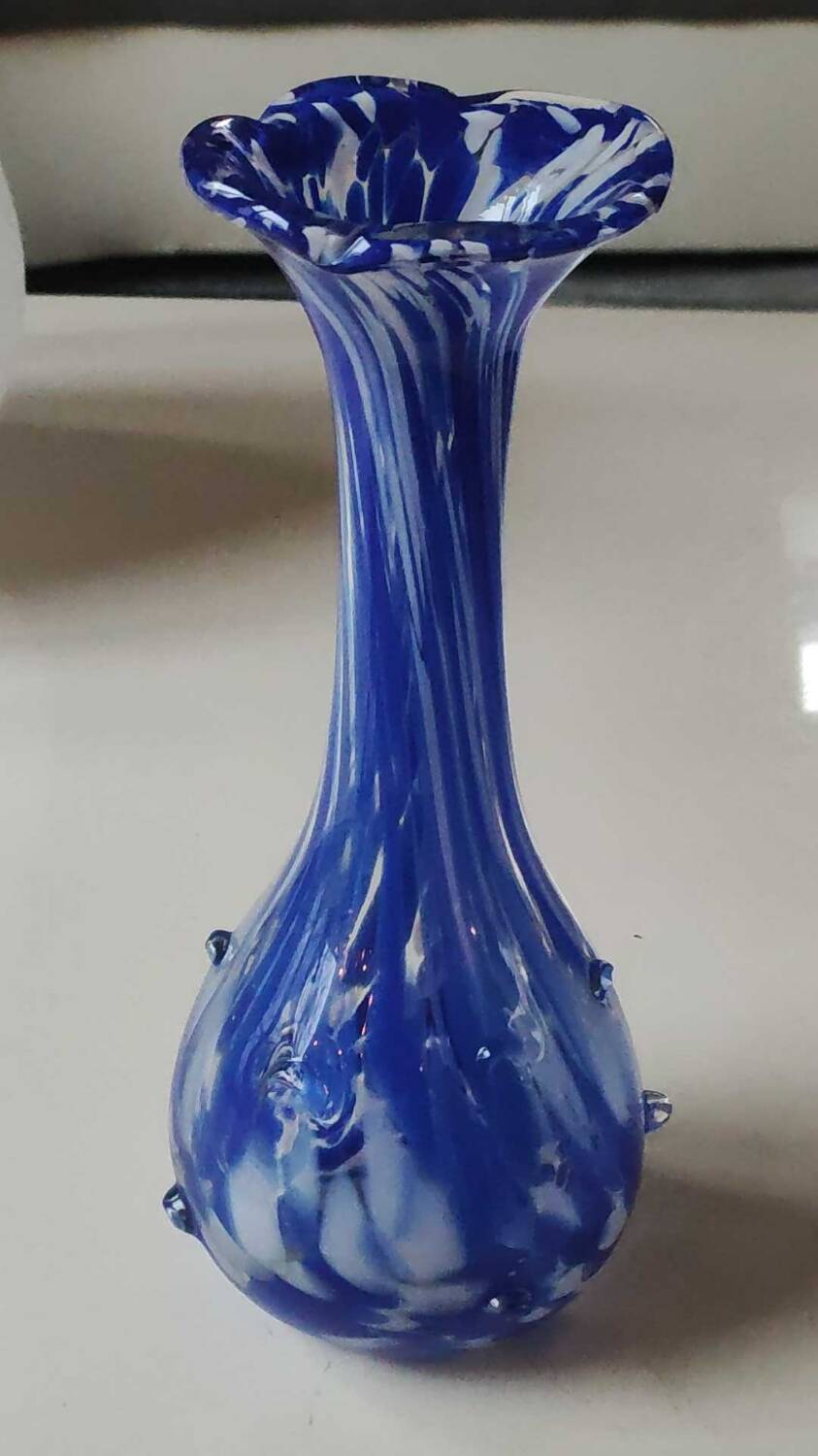 Murano style floral vase. Corolla neck, speckled cobalt blue & white. Dim 24 x 10 cm