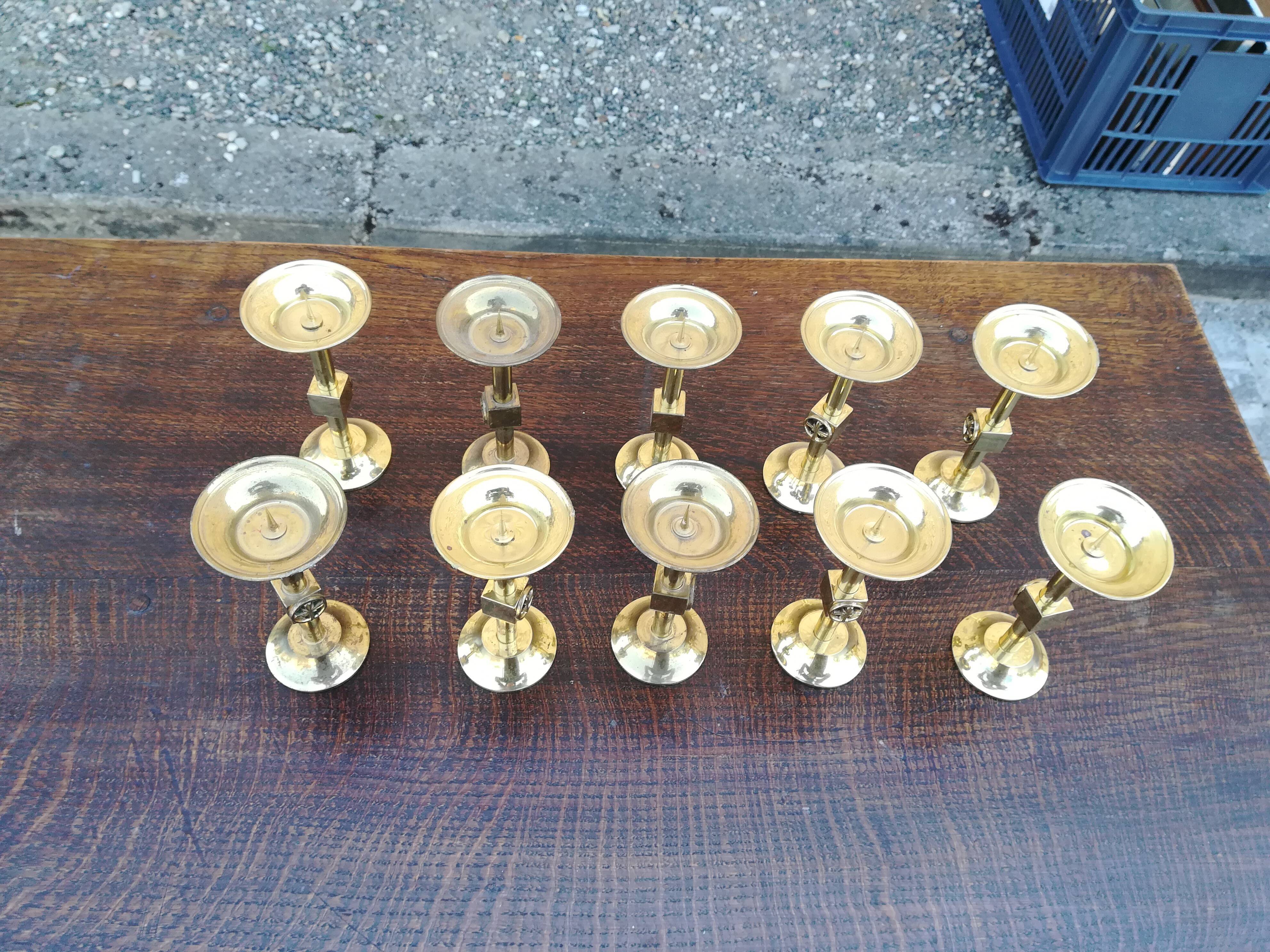 Lot of ten peaks candles in brass
