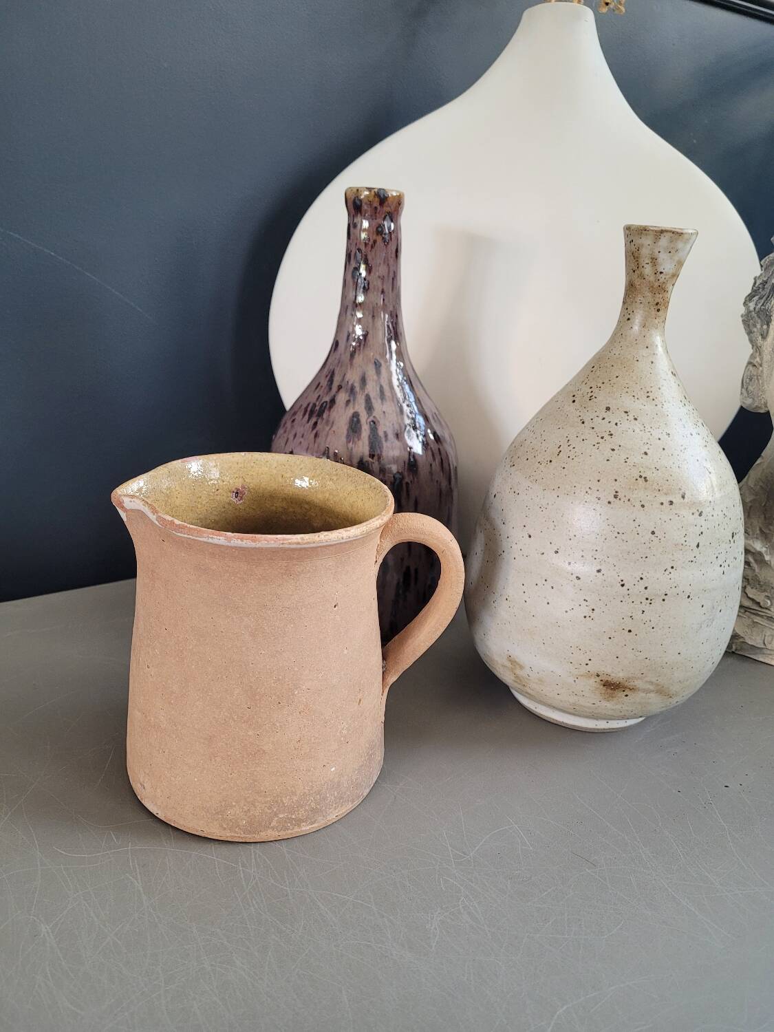 Antique milk jug in glazed terracotta