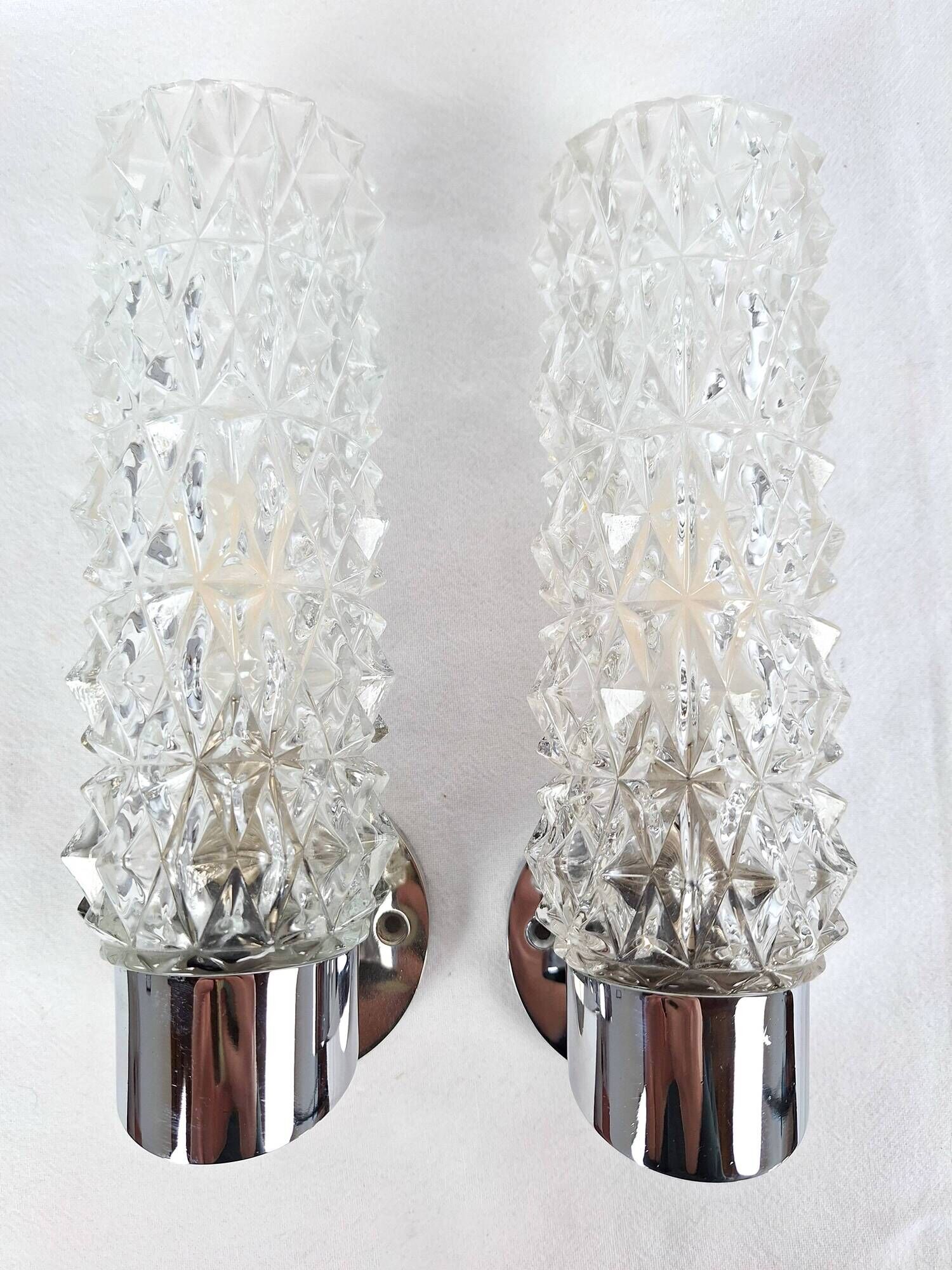 Pair of vintage Art Deco space age chrome and molded glass wall sconces