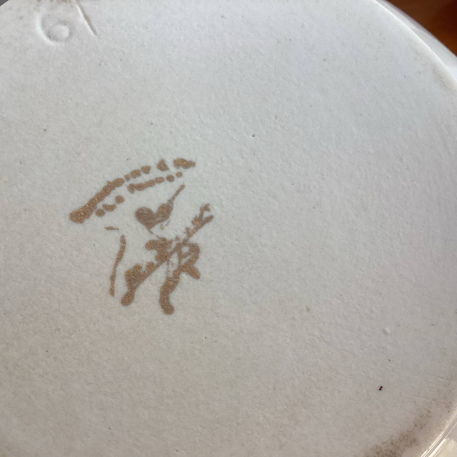 Antique porcelain coffee pot with stamped fire