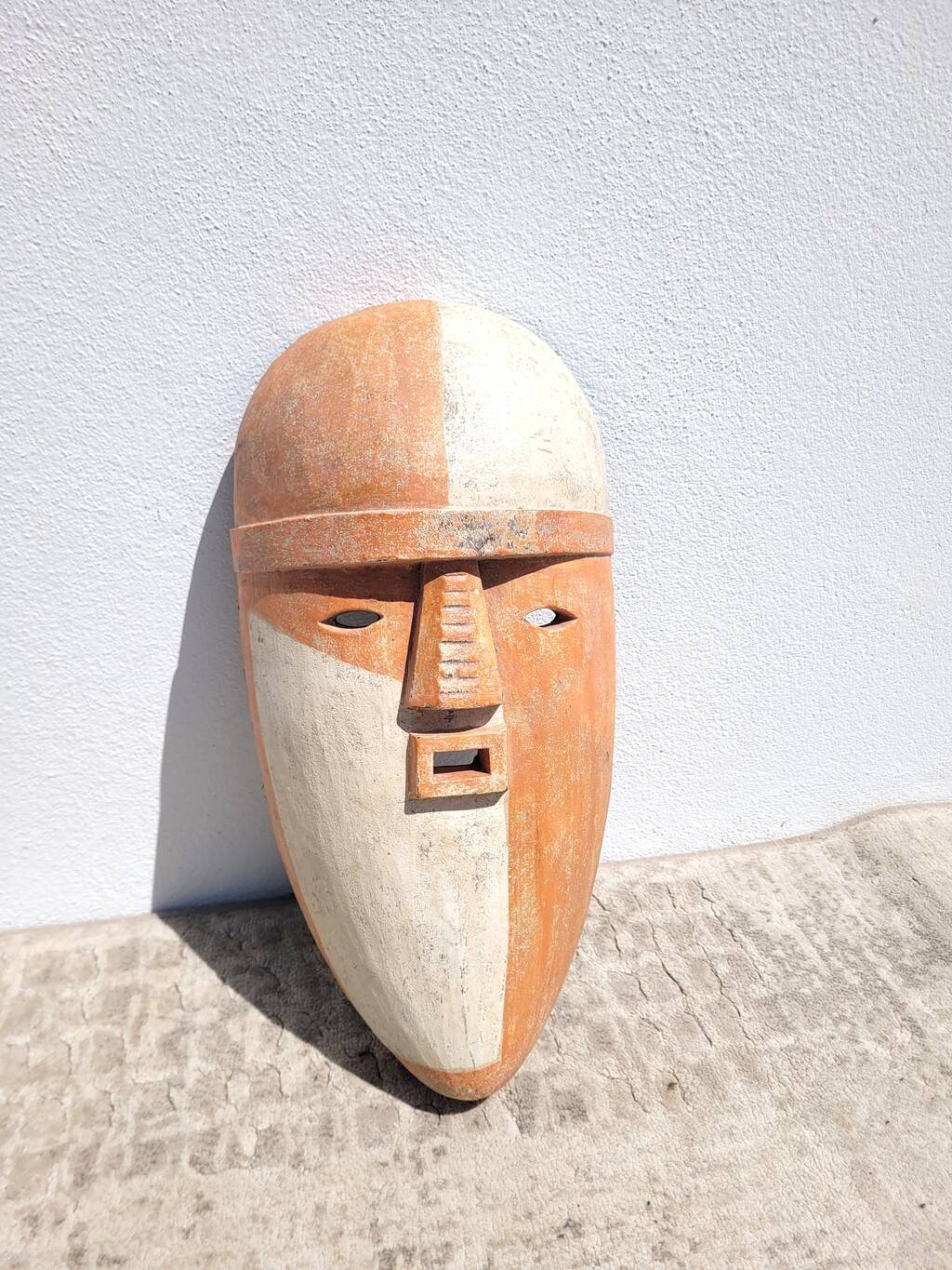 Wooden mask in the spirit of Adouma
