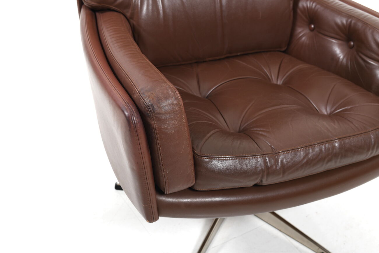 Danish swivel lounge chair in brown leather