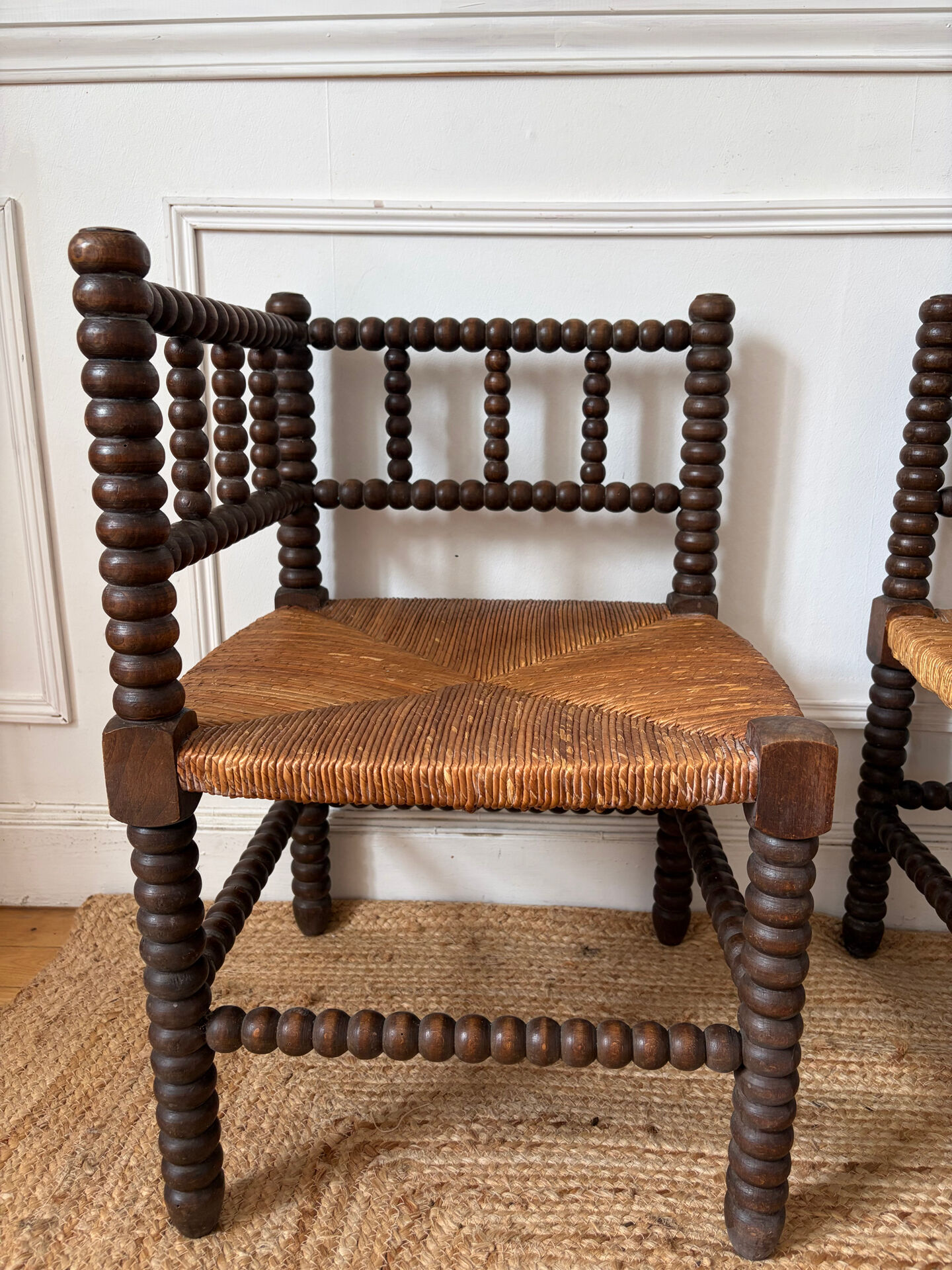 Pair of rush-seated chairs by the fireside "bobbin"