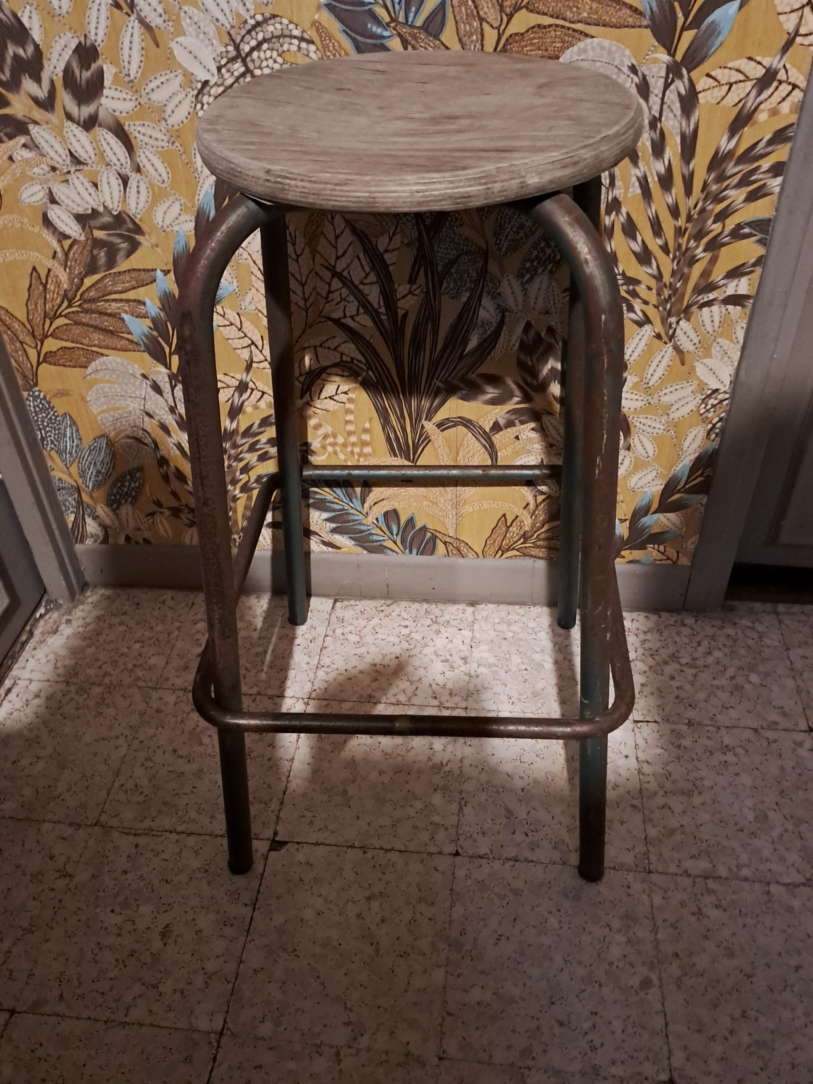 High metal stool and wooden seat Labo style dating from the 1940s industrial style