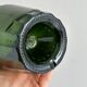 Translucent green glass bottle, classic design.